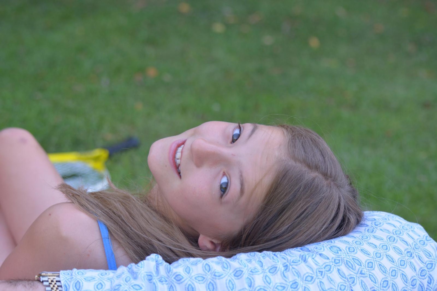 Rosie smiling in the grass