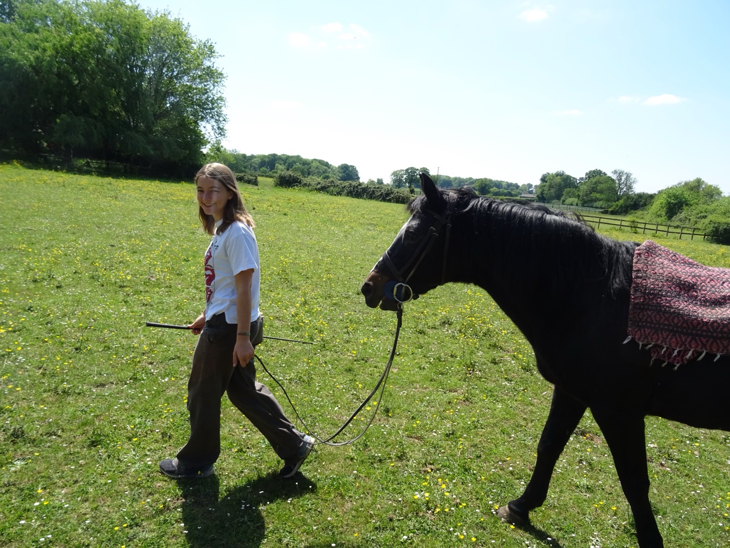 Rosie leading her horse